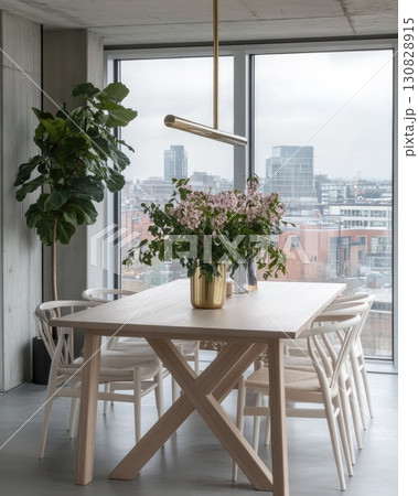 Modern Interior Dining Room With Wooden Table Floral Arrangement and City View 130828915