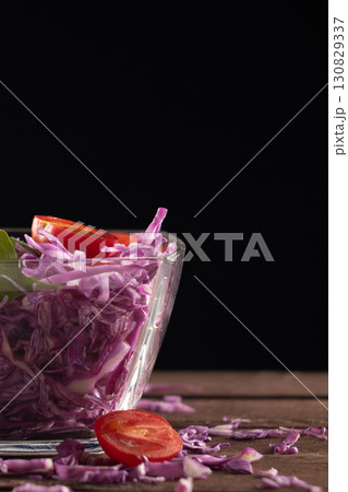 Glass bowl with red cabbage and tomatoes Glass bowl with red cabbage and tomatoes 130829337