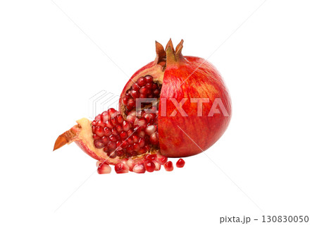 Fresh pomegranate sliced showing vibrant red seeds, isolated, PNG 130830050