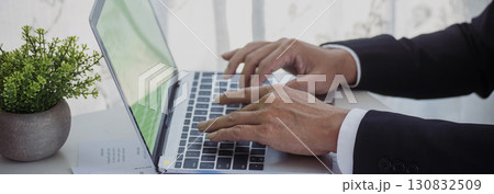 Banner Asian Business man hands using calculator counting tax financial bill. Tax audit Finacial concept. Panorama Close up businessman hands calculating number tax audit planning with copy space 130832509