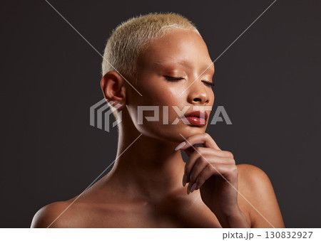 Skincare, makeup and face of black woman, eyes closed and dark studio with platinum hair. Art aesthetic, cosmetics and beauty, African model isolated on grey background with glowing spa skin facial. Skincare, makeup and face of black woman, eyes closed and dark studio with platinum hair. Art aesthetic, cosmetics and beauty, African model isolated on grey background with glowing spa skin facial. 130832927