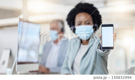 Call center, phone and woman face mask with mockup for covid compliance, safety and health mobile app. African telemarketing agent, consultant or person portrait and cellphone screen or mock up space Call center, phone and woman face mask with mockup for covid compliance, safety and health mobile app. African telemarketing agent, consultant or person portrait and cellphone screen or mock up space 130832994