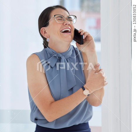 Phone call, laughing and funny with a business woman in her office, talking on her mobile to share good news. Contact, conversation and humor with a young female employee joking while working Phone call, laughing and funny with a business woman in her office, talking on her mobile to share good news. Contact, conversation and humor with a young female employee joking while working 130833052