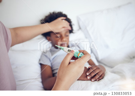 Sick kid in bed, mom and thermometer, fever from cold or flu with virus and healthcare. Love, support and health problem, woman check temperature of boy at family home and illness with medical care Sick kid in bed, mom and thermometer, fever from cold or flu with virus and healthcare. Love, support and health problem, woman check temperature of boy at family home and illness with medical care 130833053