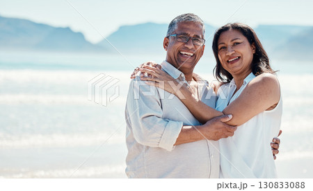 Love, portrait and old couple hug on beach, embrace and romance in happy relationship and mockup. Romantic retirement vacation, senior woman and man hugging on ocean holiday travel with smile on face 130833088