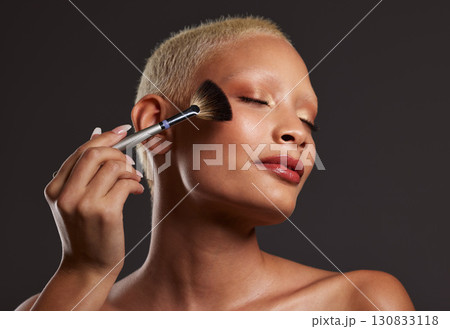 Makeup, brush and woman with cosmetics in studio for beauty products, foundation or highlighter application. Salon aesthetic, cosmetology and face of girl model for eyeshadow, facial and luxury style Makeup, brush and woman with cosmetics in studio for beauty products, foundation or highlighter application. Salon aesthetic, cosmetology and face of girl model for eyeshadow, facial and luxury style 130833118