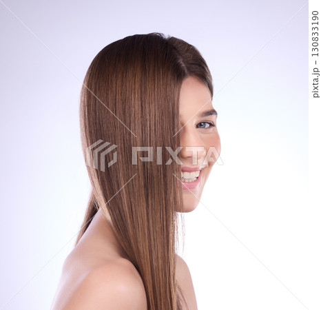 Beauty, face portrait and hair care of woman in studio isolated on a background. Cosmetics, makeup skincare and happy female model with salon treatment for healthy growth, balayage and hairstyle. 130833190