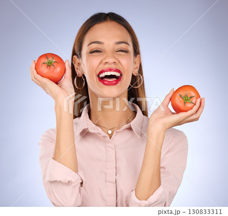 Portrait, black woman and tomatoes for diet, vegan and healthy lifestyle against a grey studio background. Face, Jamaican female and lady with red vegetables, aesthetics and wellness with happiness 130833311