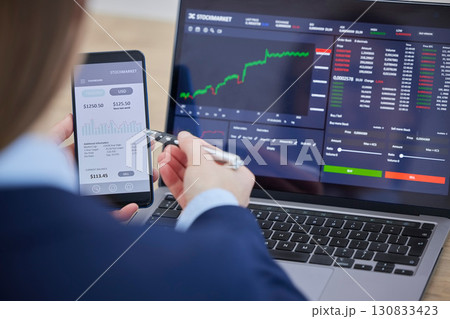 Closeup, hands and finance with stock market, technology and planning for investments, review and profit growth. Zoom, female employee or investor with smartphone, laptop or charts for digital review Closeup, hands and finance with stock market, technology and planning for investments, review and profit growth. Zoom, female employee or investor with smartphone, laptop or charts for digital review 130833423