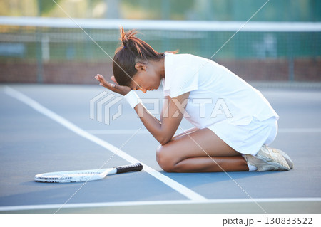 Tennis, stress and woman with depression on court after failure in match, game or competition. Mental health, anxiety and sad female athlete with headache, migraine or exhausted after sports exercise 130833522