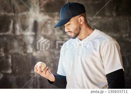 Baseball field, thinking or man with a ball in training ready for match or game on bench dugout in summer. Workout exercise, mindset or thoughtful young sports player focused on playing softball Baseball field, thinking or man with a ball in training ready for match or game on bench dugout in summer. Workout exercise, mindset or thoughtful young sports player focused on playing softball 130833711
