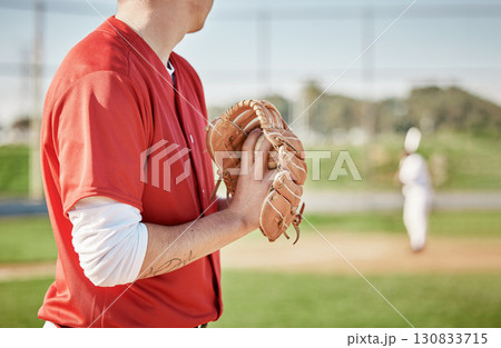 Baseball, glove and pitch with a sports man on a field during a competitive game outdoor during the day. Fitness, event and pitching with a male athlete playing a match in sportswear outside Baseball, glove and pitch with a sports man on a field during a competitive game outdoor during the day. Fitness, event and pitching with a male athlete playing a match in sportswear outside 130833715
