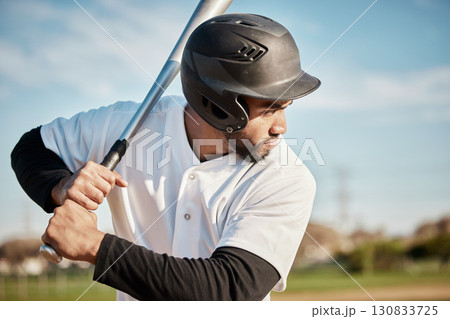 Baseball, bat and serious with a sports man outdoor, playing a competitive game during summer. Fitness, health and exercise with a male athlete or player training on a field for sport or recreation Baseball, bat and serious with a sports man outdoor, playing a competitive game during summer. Fitness, health and exercise with a male athlete or player training on a field for sport or recreation 130833725