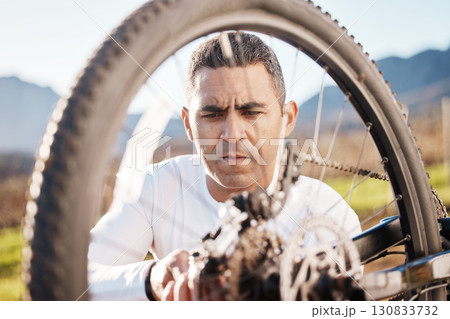 Cycling, repair and wheel with man in nature for sports, wellness and fitness training. Adventure, safety and tire change with cyclist fixing mountain bike on trail for broken, puncture and check Cycling, repair and wheel with man in nature for sports, wellness and fitness training. Adventure, safety and tire change with cyclist fixing mountain bike on trail for broken, puncture and check 130833732