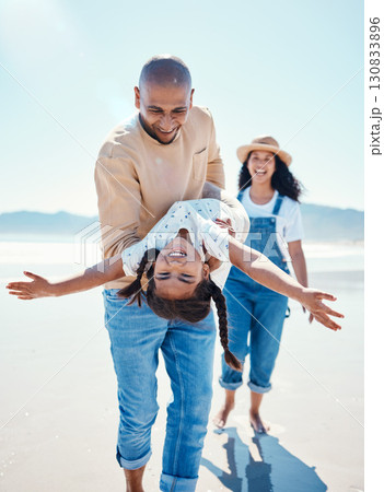 Family, beach and parents play with girl for bonding, quality time and adventure together by ocean. Travel, love and happy mom, dad and child enjoy summer holiday, vacation and relax on weekend Family, beach and parents play with girl for bonding, quality time and adventure together by ocean. Travel, love and happy mom, dad and child enjoy summer holiday, vacation and relax on weekend 130833896