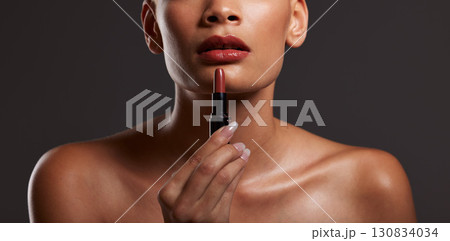 Beauty, makeup and lips of woman with lipstick in studio for cosmetics, skincare products and fashion. Salon aesthetic, cosmetology and girl model with red gloss for beauty, mouth and luxury style Beauty, makeup and lips of woman with lipstick in studio for cosmetics, skincare products and fashion. Salon aesthetic, cosmetology and girl model with red gloss for beauty, mouth and luxury style 130834034