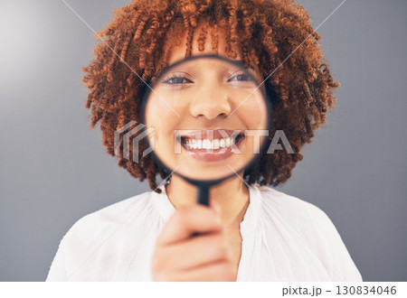 Magnifying glass, focus and smile with portrait of black woman for analysis, exploration and close up. Detective, search and spy with girl and magnifier for investigation, zoom or discovery in studio Magnifying glass, focus and smile with portrait of black woman for analysis, exploration and close up. Detective, search and spy with girl and magnifier for investigation, zoom or discovery in studio 130834046
