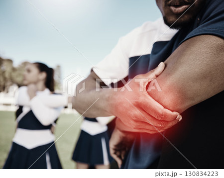 Cheerleader, sports or hand on elbow injury, pain or accident on field in game or training match. Red glow, fitness zoom or cheerleading male person with a medical emergency, joint or muscle sprain Cheerleader, sports or hand on elbow injury, pain or accident on field in game or training match. Red glow, fitness zoom or cheerleading male person with a medical emergency, joint or muscle sprain 130834223