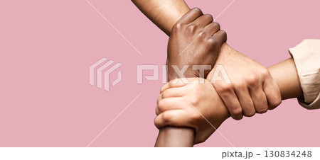 People, diversity and hands together in teamwork collaboration for trust against a pink studio background. Diverse group of friends holding hand in unity, solidarity or community agreement on mockup 130834248