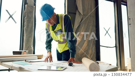 Man, blueprint and architect at construction site, engineering and urban infrastructure with contractor. Floor plan, paperwork and illustration, renovation and property development with maintenance Man, blueprint and architect at construction site, engineering and urban infrastructure with contractor. Floor plan, paperwork and illustration, renovation and property development with maintenance 130834477