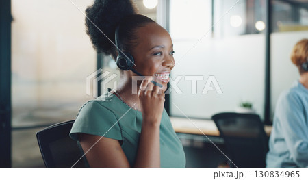 Consultant, call center and business woman talking for e commerce communication, customer services and online chat. Excited african agent or consultant in headphones helping, speaking or night advice 130834965