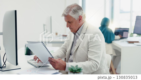 Business man, computer and documents in office for financial management, company taxes and revenue proposal. Professional boss, executive or accountant on desktop typing, reading account and budget Business man, computer and documents in office for financial management, company taxes and revenue proposal. Professional boss, executive or accountant on desktop typing, reading account and budget 130835013