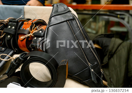 handcrafted leather goods, including notebooks, wallets, and a belt handcrafted leather goods, including notebooks, wallets, and a belt 130837254