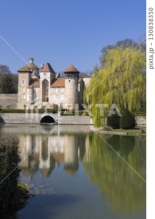 Chateau de Sercy reflecting in the moat in Bourgogne Franche Comte, France Chateau de Sercy reflecting in the moat in Bourgogne Franche Comte, France 130838350