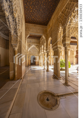 Exploring the Alhambra Palace, intricate moorish architecture and serene courtyard in Granada, Spain Exploring the Alhambra Palace, intricate moorish architecture and serene courtyard in Granada, Spain 130838433