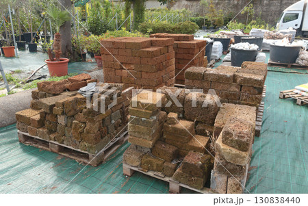 Outdoor tiles, natural stone bars for garden in European store. Gardening and hobby. Nature and plants. Outdoor tiles, natural stone bars for garden in European store. Gardening and hobby. Nature and plants. 130838440