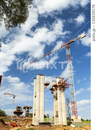 Cranes working on highway bridge construction in D11 near Bernartice, Czechia Cranes working on highway bridge construction in D11 near Bernartice, Czechia 130838576