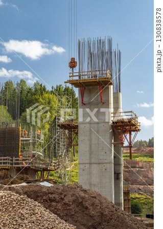 Construction workers building concrete bridge support pillars in D11 near Bernartice, Czechia 130838578