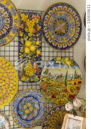 Traditional Italian ceramics with vibrant colors and detailed patterns, showcased in a shop in Assisi, Umbria 130838611