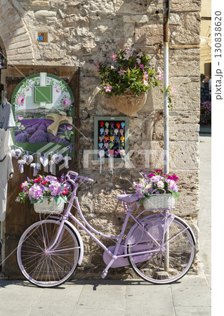 Purple Bicycle Adorning a Flower Shop in Assisi, Italy 130838620