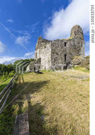 Ruins of Primda Castle rising on a hill under blue sky in Czechia 130838705