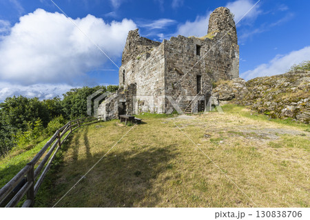 Ruins of Primda Castle rising on a hill under blue sky in Czechia 130838706