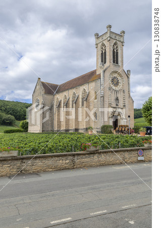 Church standing in the middle of vineyards in Fuisse, France 130838748