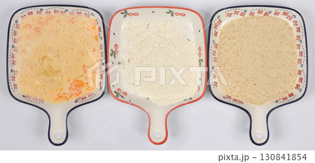 Beaten eggs, flour, and breadcrumbs for breading Beaten eggs, flour, and breadcrumbs for breading 130841854