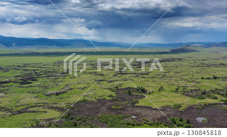 Steppe and mountains with rain landscape Steppe and mountains with rain landscape 130845818