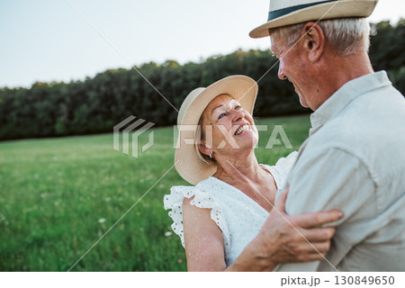 Elderly man and woman spending time in nature. 130849650