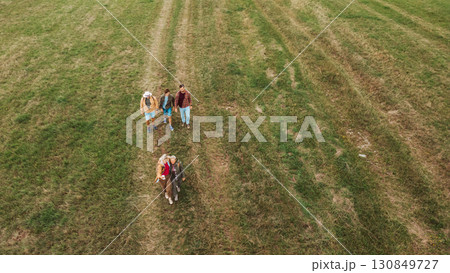Aerial view of multigenerational family on hiking trip in nature. Aerial view of multigenerational family on hiking trip in nature. 130849727