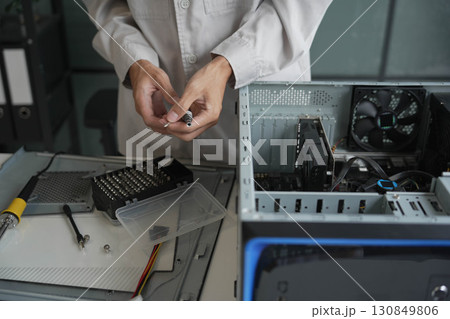 Computer Hardware dissemblers fixing computer PC. 130849806