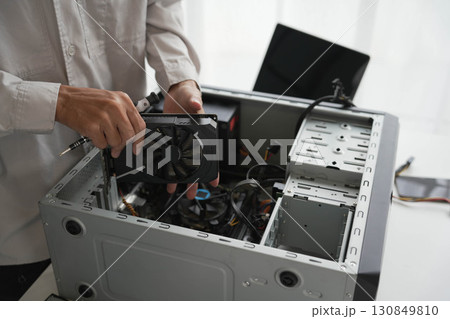 Computer Hardware dissemblers fixing computer PC. 130849810