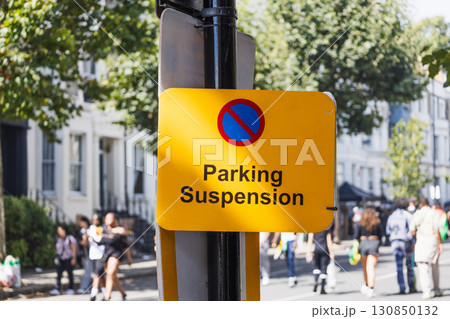 Temporary Parking Suspension Sign on UK City Street 130850132