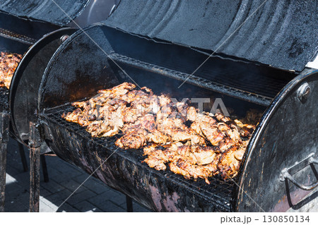 Smoky Barbecue Chicken on Outdoor Charcoal Grill Smoky Barbecue Chicken on Outdoor Charcoal Grill 130850134