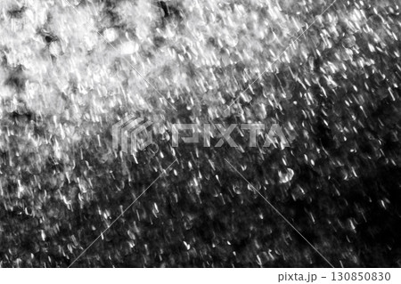 Photo of a frozen window with a black and white background outside the window. Natural texture of ice on glass. Abstract nature background 130850830