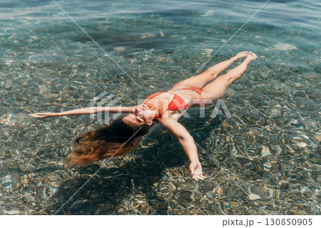 Woman Bikini Floating Sea Water Clear Calm Relaxing Woman Bikini Floating Sea Water Clear Calm Relaxing 130850905