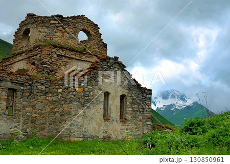 The ruined church of the Assumption of the Blessed Virgin Mary in the village of Lisri. Mamison gorge, Republic of North Ossetia. 130850961