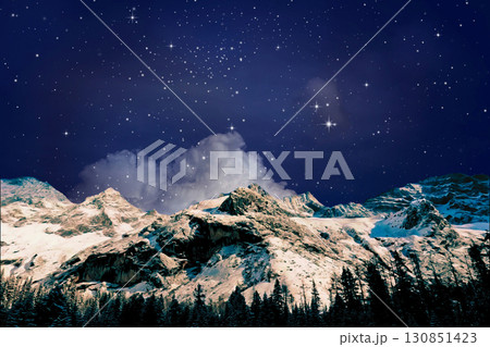 night view of snowy mountain range and milky way. starry night sky with stars and moon. beautiful landscape with snowy mountain peaks in winter night. 130851423