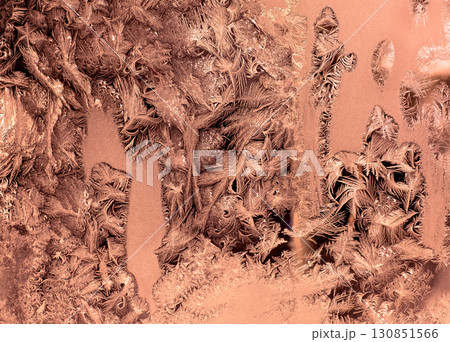 Icy window glass. Abstract natural background. Mocha mousse trendy color. Winter window 130851566